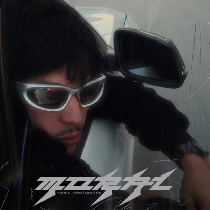 Official cover artwork for "MORAL" by Y24, featuring a cinematic portrait with futuristic sunglasses and an urban aesthetic.
